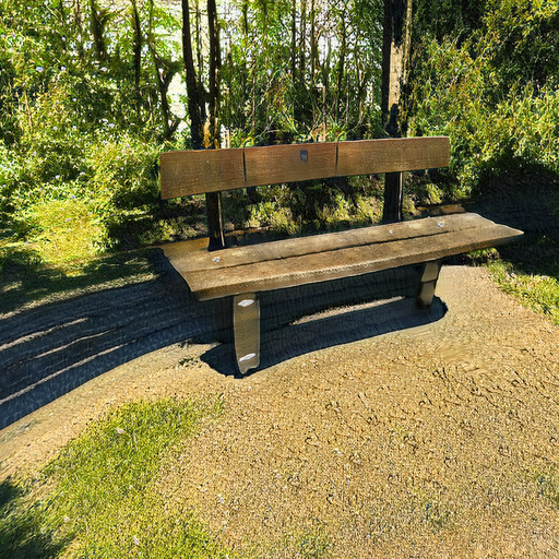A photograph of a memorial bench which has been generated using artificial intelligence.