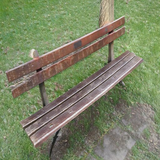 A photograph of a memorial bench which has been generated using artificial intelligence.